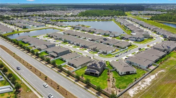 a aerial view of a house with swimming pool and garden