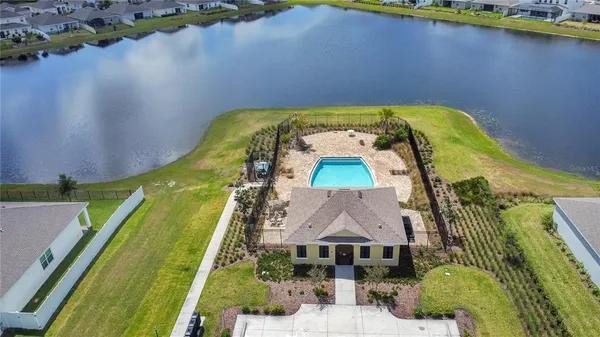 an aerial view of a house with a swimming pool