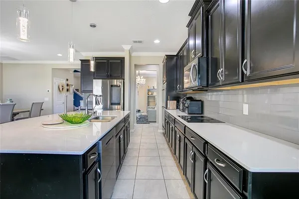 a kitchen with counter top space cabinets and stainless steel appliances