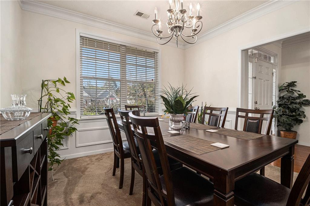 5610 Swanson Road Ellenwood, GA 30294 - Photo 11 of 28 a view of a dining room with furniture and window