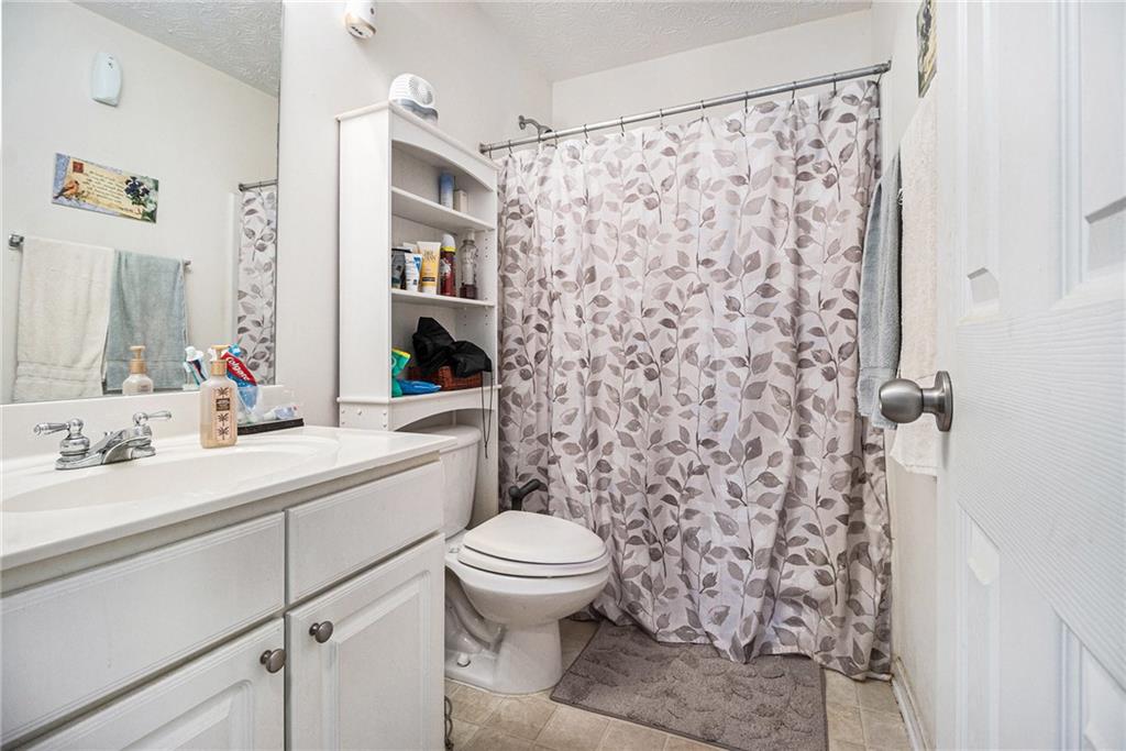 5610 Swanson Road Ellenwood, GA 30294 - Photo 19 of 28 a bathroom with a sink toilet and shower
