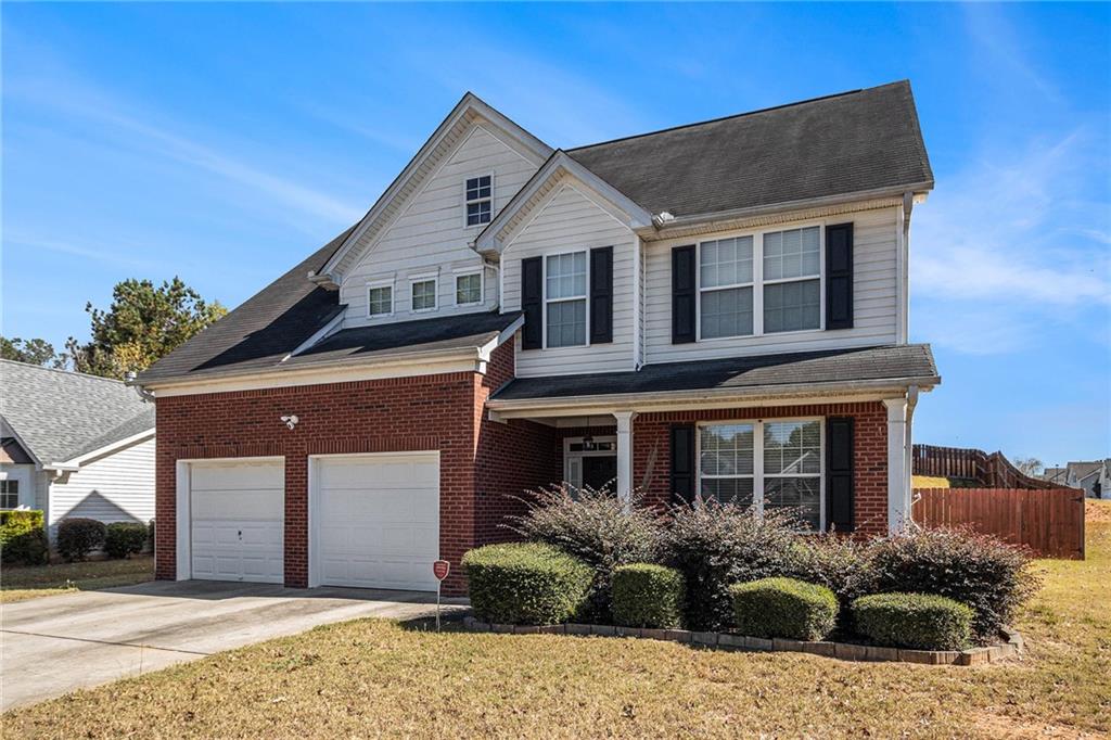 5610 Swanson Road Ellenwood, GA 30294 - Photo 2 of 28 a front view of a house with a yard