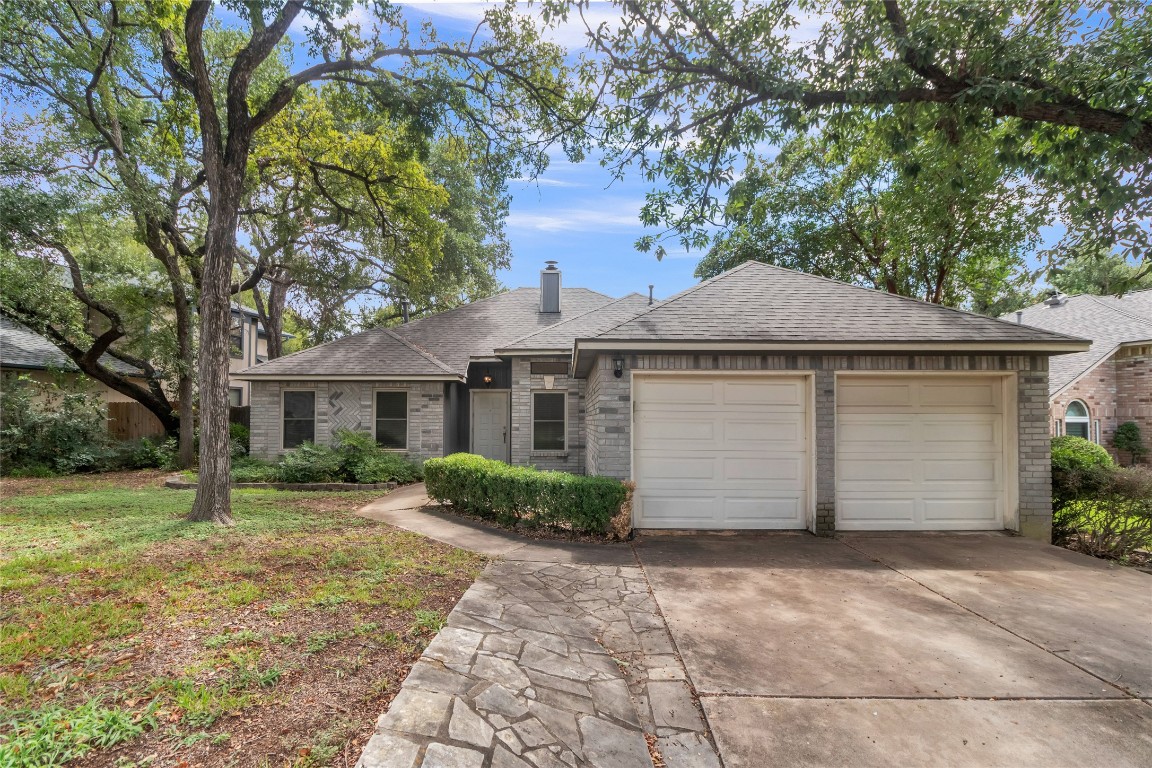 15705 Racine Cove Austin, TX 78717 - Photo 1 of 1 a front view of a house with a yard and garage