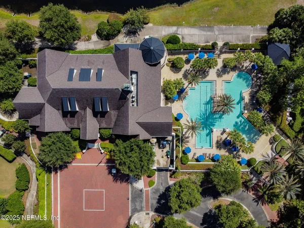 an aerial view of house with yard swimming pool and outdoor seating