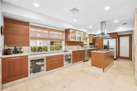 a large kitchen with stainless steel appliances lots of counter top space