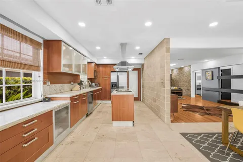 a kitchen with stainless steel appliances granite countertop a stove and a refrigerator