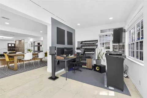 a bedroom with a bed and a potted plant