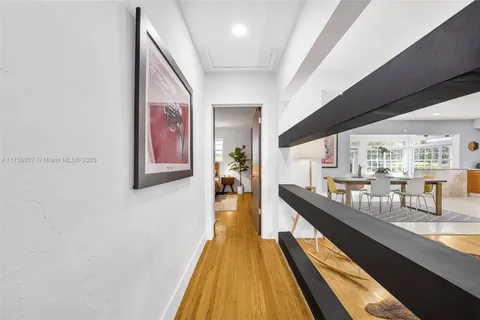 a spacious bathroom with a double vanity sink a mirror and a shower