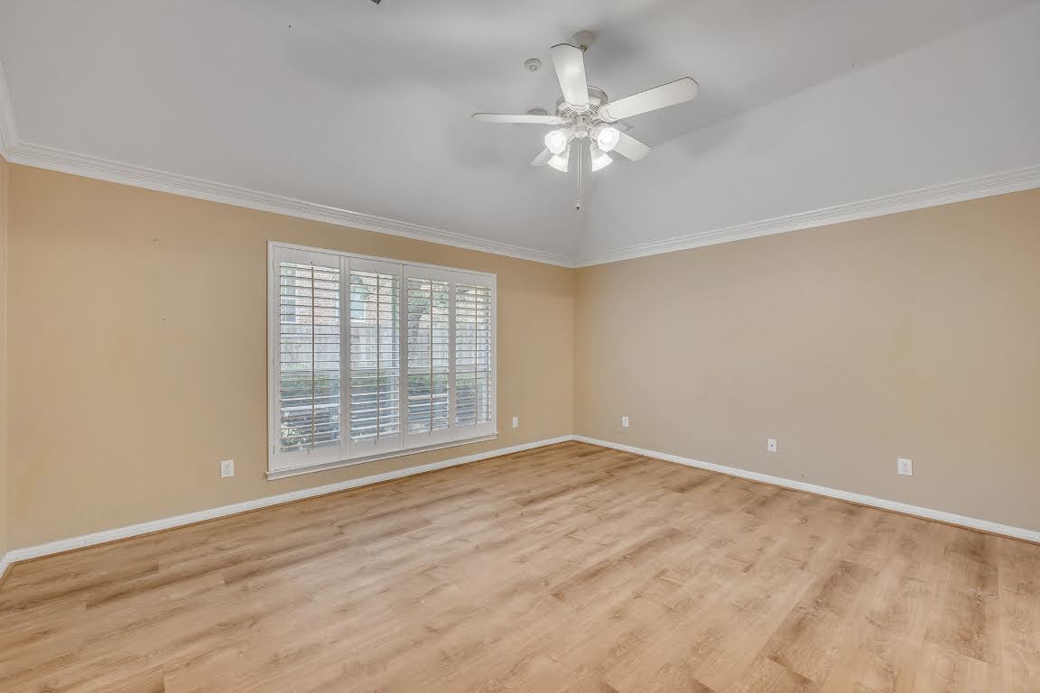 2726 Grimes Ranch Road Austin, TX 78732 - Photo 24 of 35 Spare room with light wood-style floors, crown molding, a ceiling fan, and lofted ceiling