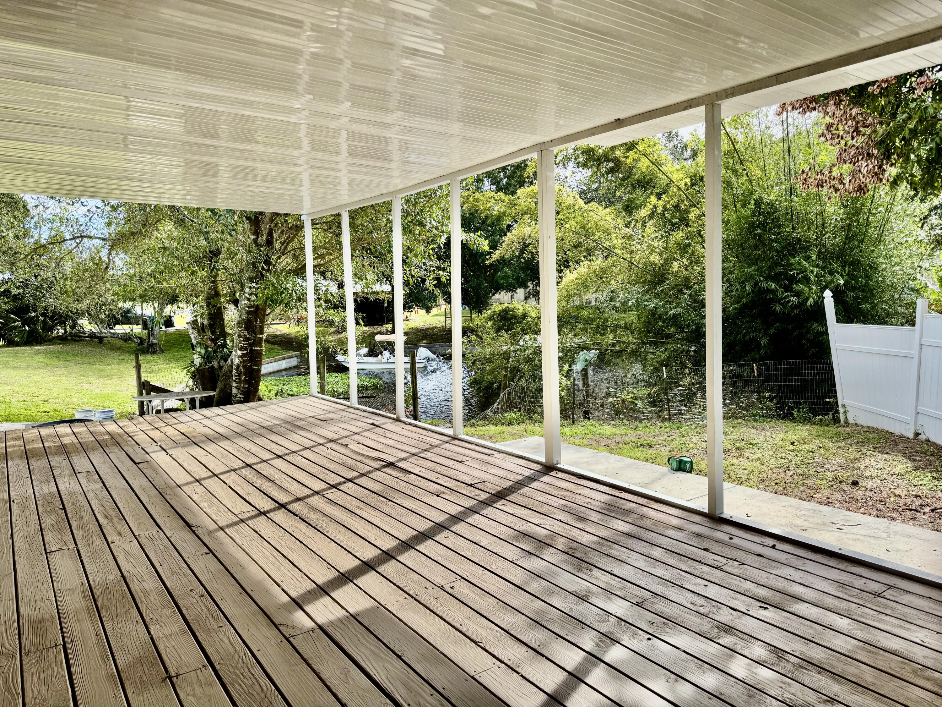 3200 Southeast 18th Court Okeechobee, FL 34974 - Photo 3 of 21 a view of a backyard of the house