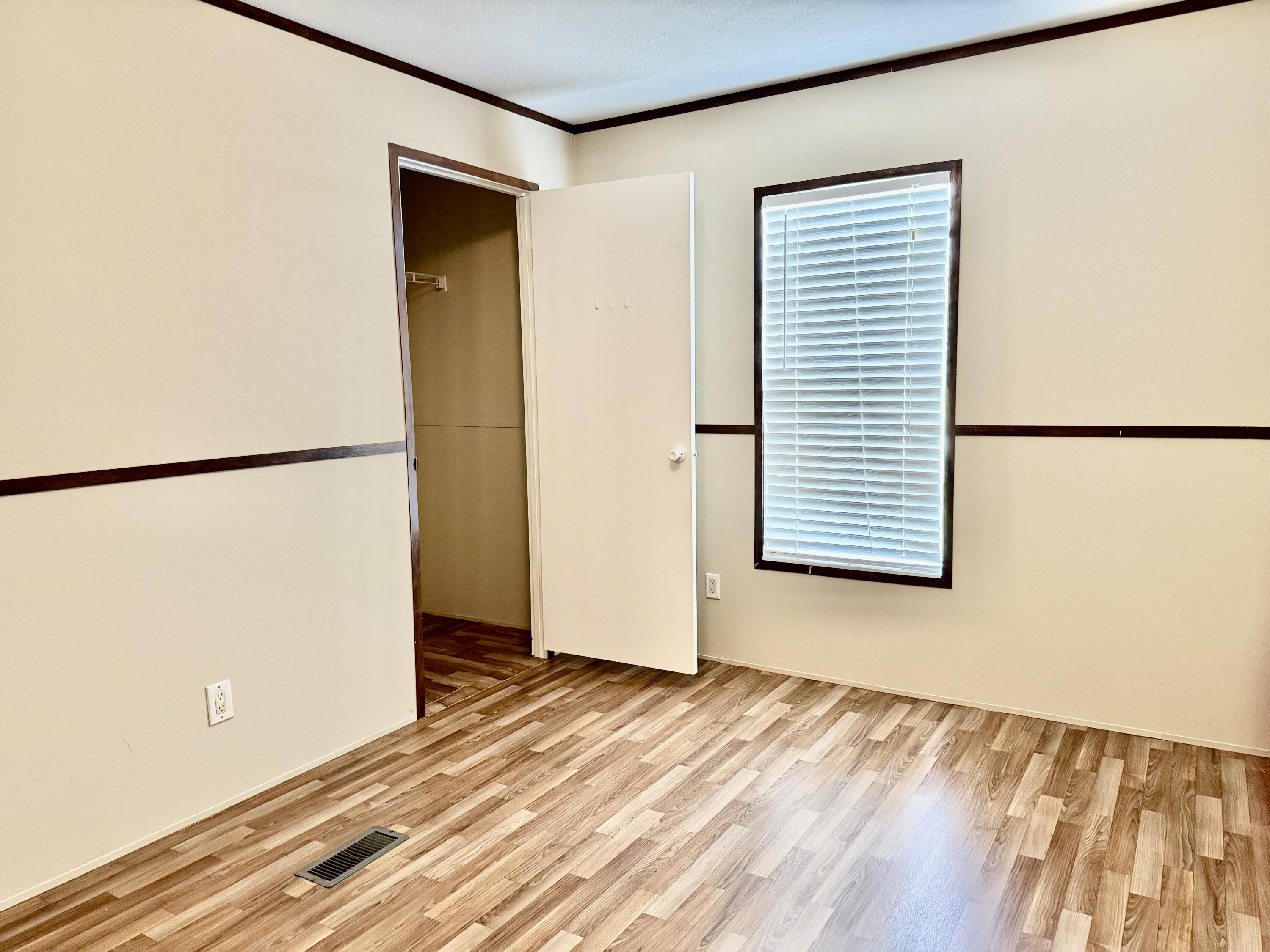 3200 Southeast 18th Court Okeechobee, FL 34974 - Photo 7 of 21 a view of a room with a wooden floor