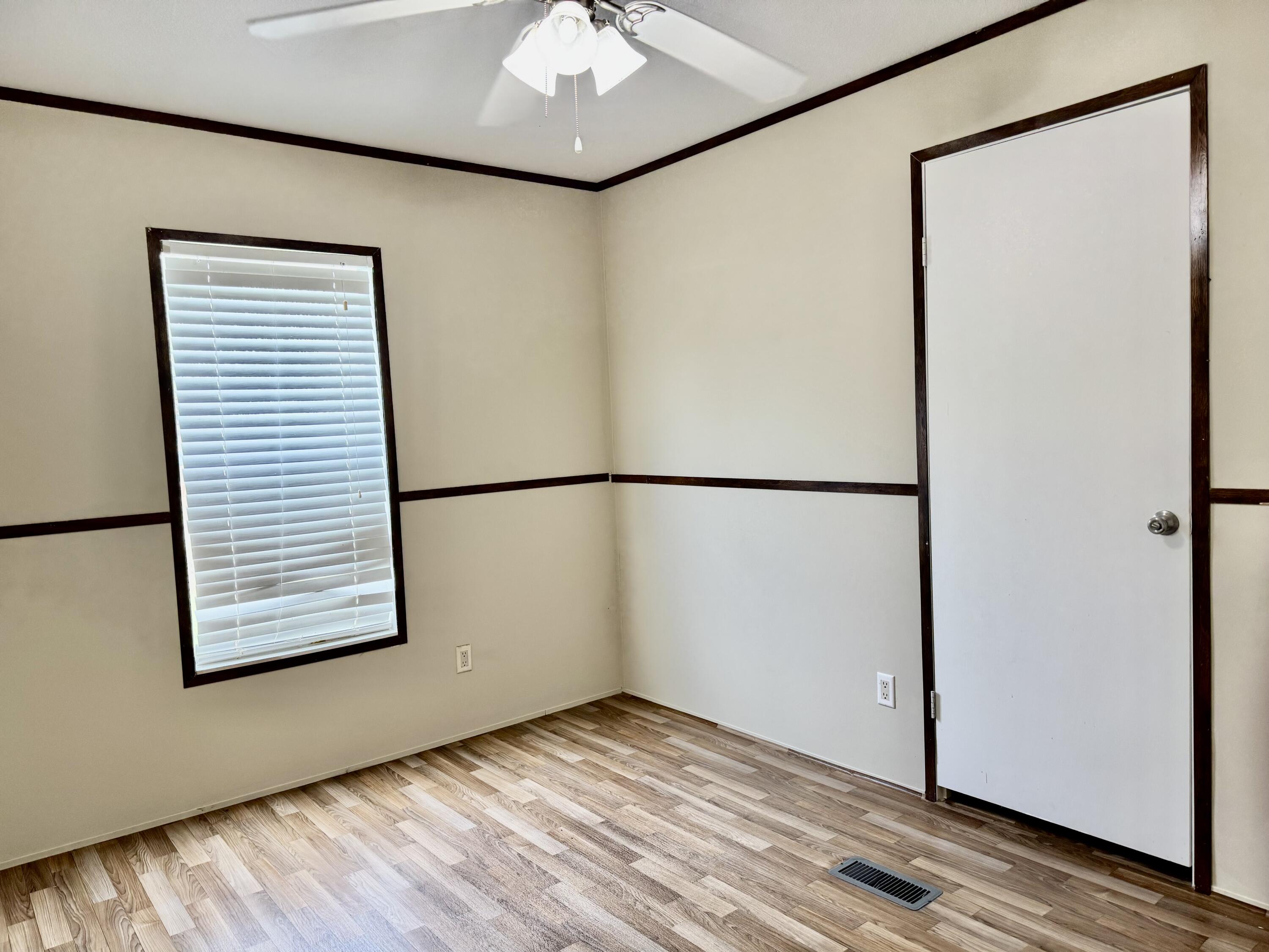 3200 Southeast 18th Court Okeechobee, FL 34974 - Photo 9 of 21 a view of a small space with wooden floor and a window