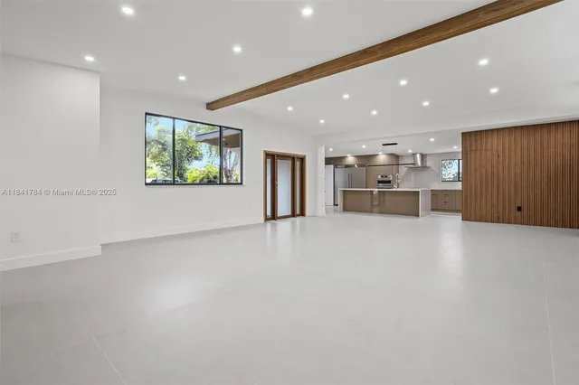 a view of a kitchen with furniture and a window