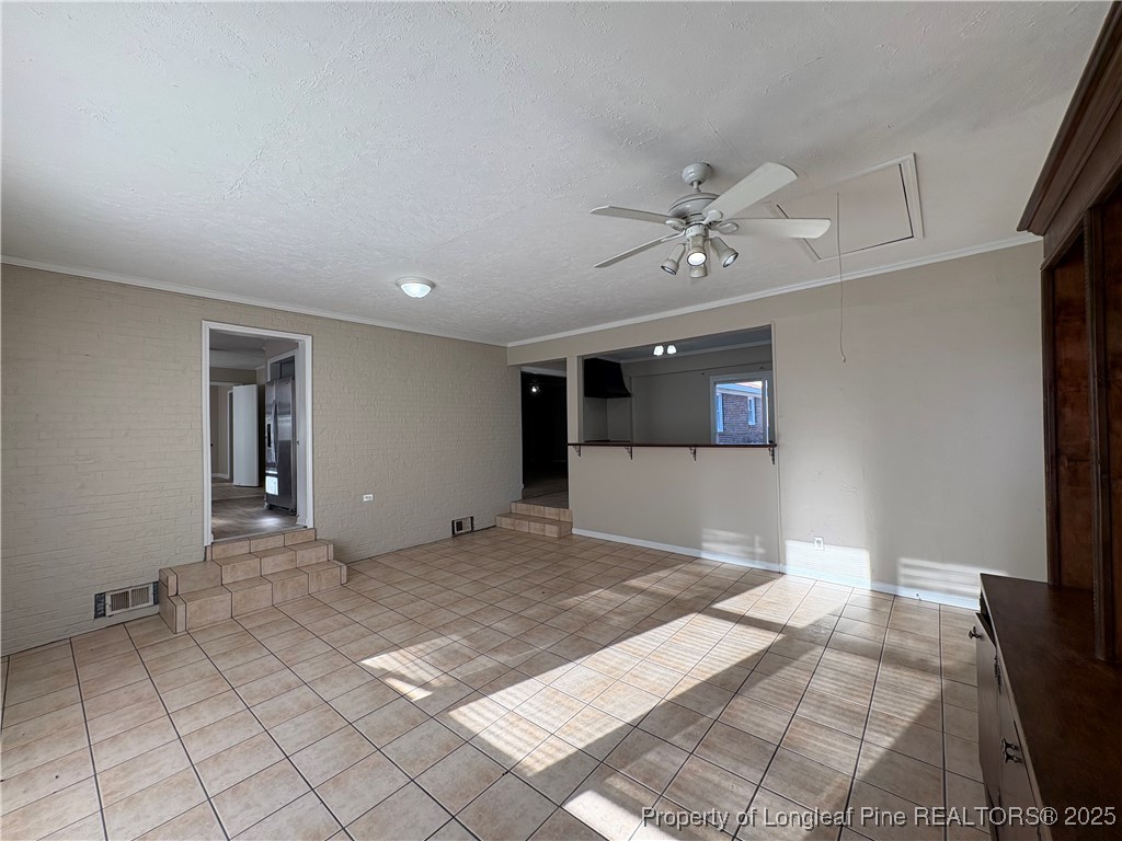 4639 Legion Road Hope Mills, NC 28348 - Photo 15 of 35 a view of a livingroom with a ceiling fan and window