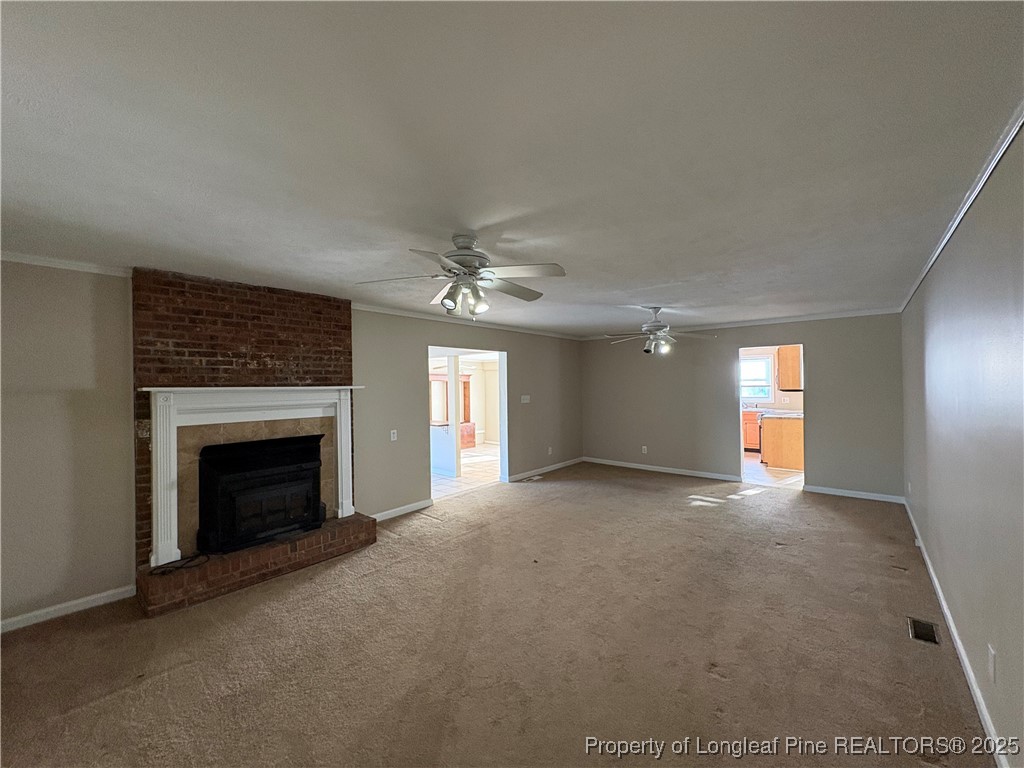 4639 Legion Road Hope Mills, NC 28348 - Photo 18 of 35 an empty room with windows and fireplace