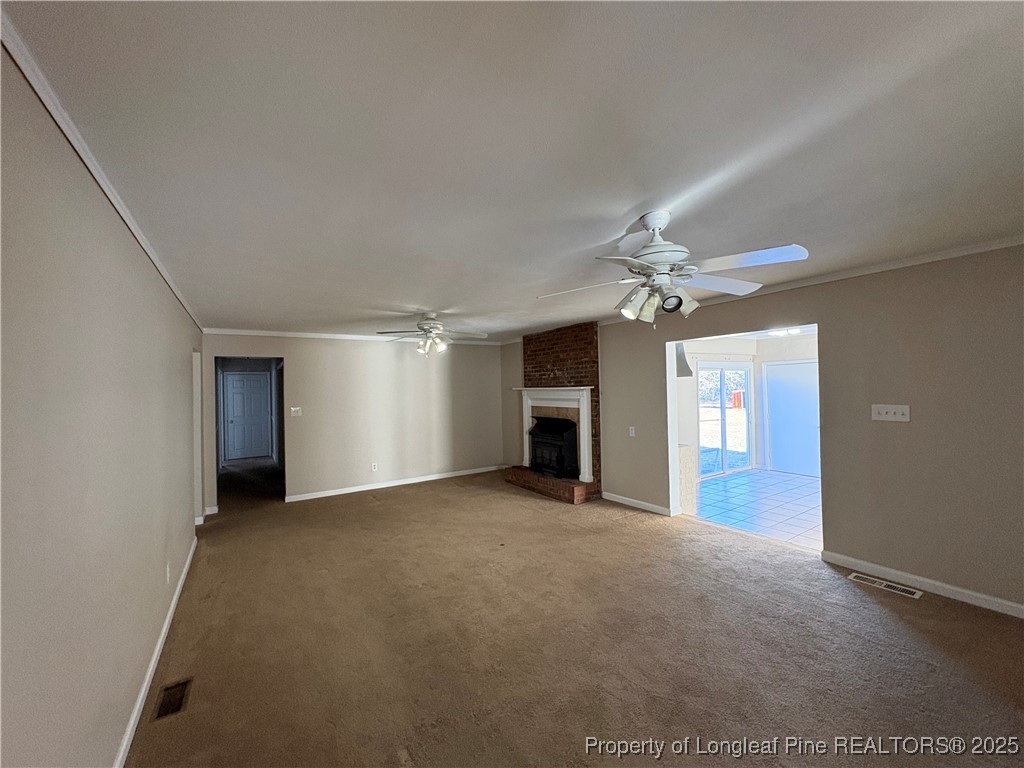 4639 Legion Road Hope Mills, NC 28348 - Photo 19 of 35 an empty room with windows and fireplace