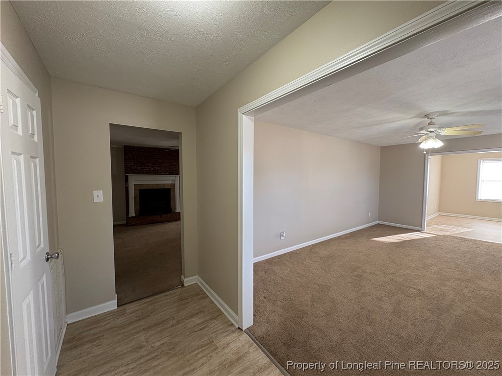4639 Legion Road Hope Mills, NC 28348 - Photo 2 of 35 a view of a hallway with wooden floor and closet