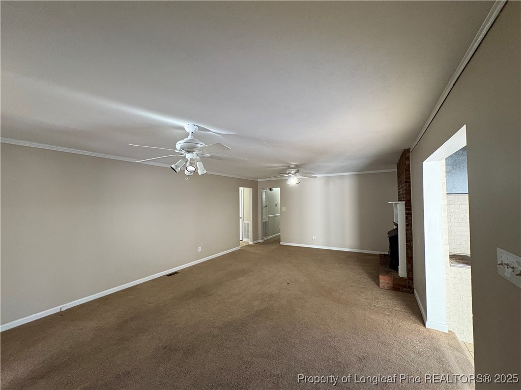 4639 Legion Road Hope Mills, NC 28348 - Photo 21 of 35 an empty room with a empty space and a ceiling fan