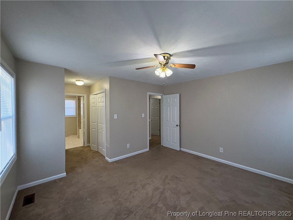 4639 Legion Road Hope Mills, NC 28348 - Photo 23 of 35 a view of an empty room with a chandelier fan