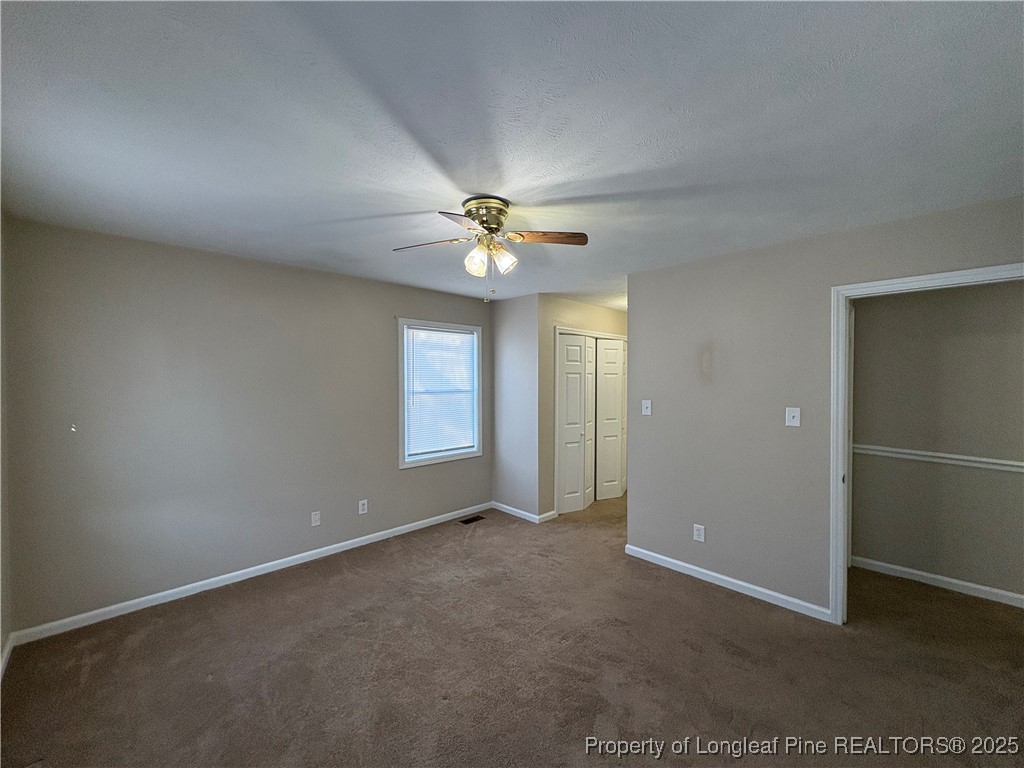 4639 Legion Road Hope Mills, NC 28348 - Photo 24 of 35 an empty room with windows and fan
