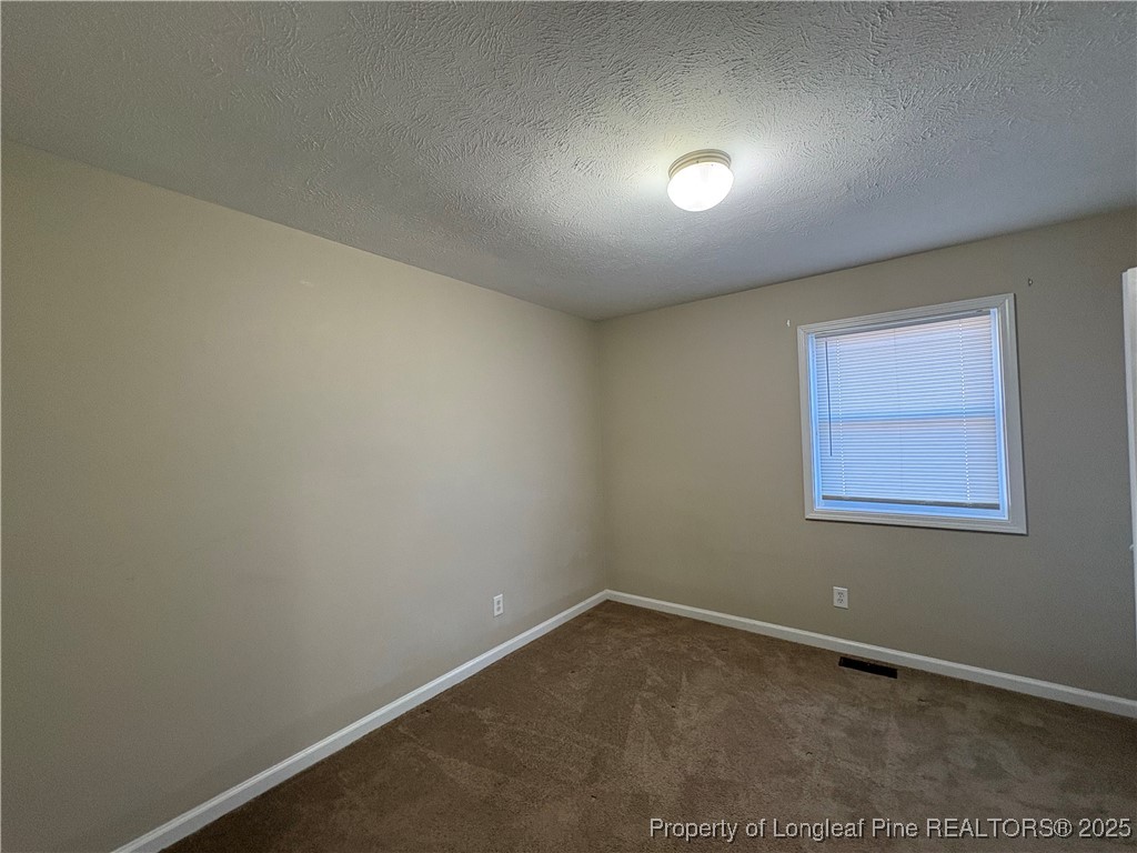 4639 Legion Road Hope Mills, NC 28348 - Photo 29 of 35 an empty room with a workbench