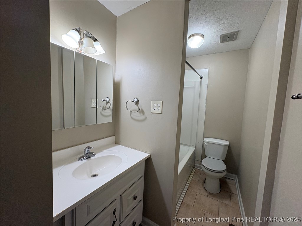 4639 Legion Road Hope Mills, NC 28348 - Photo 31 of 35 a bathroom with a sink toilet and shower