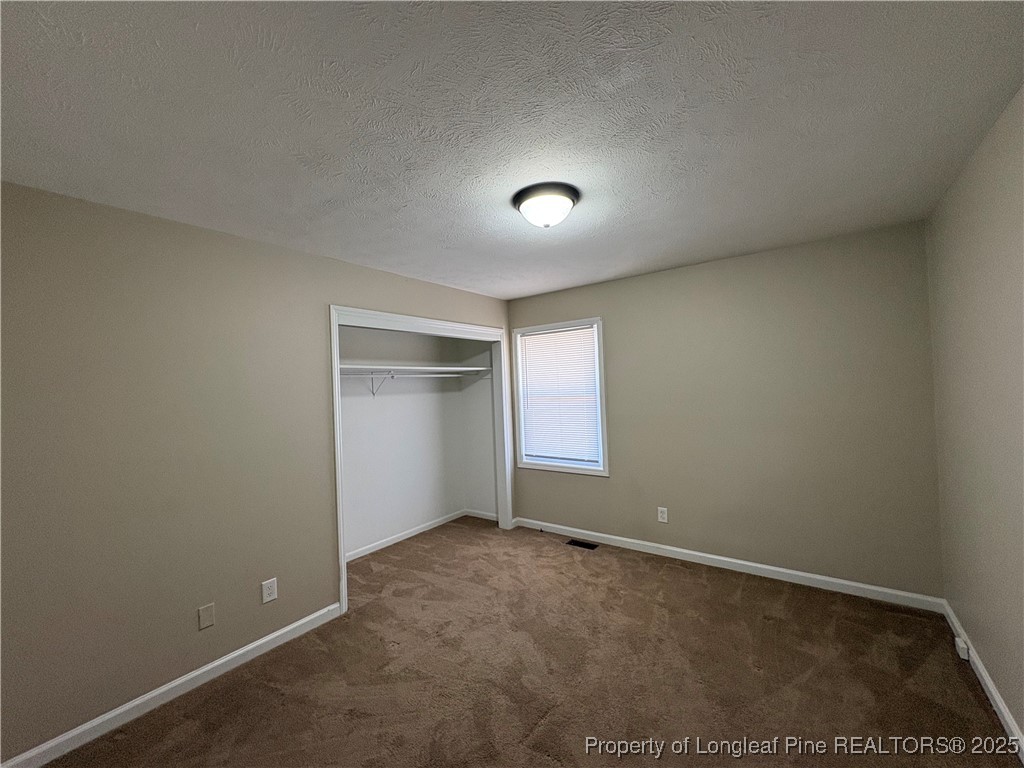 4639 Legion Road Hope Mills, NC 28348 - Photo 33 of 35 an empty room with a empty space and window