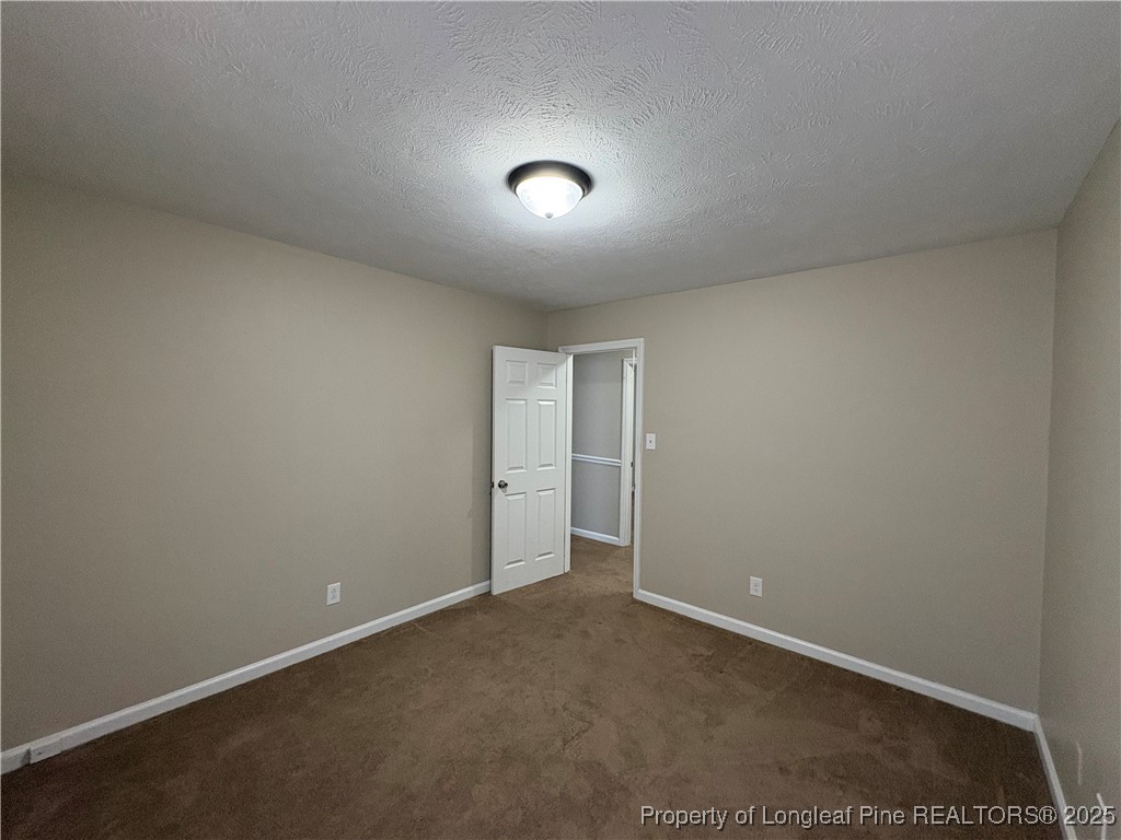 4639 Legion Road Hope Mills, NC 28348 - Photo 34 of 35 an empty room with closet and a window