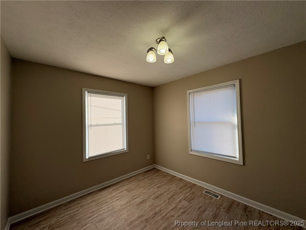 4639 Legion Road Hope Mills, NC 28348 - Photo 6 of 35 a view of an empty room with a window