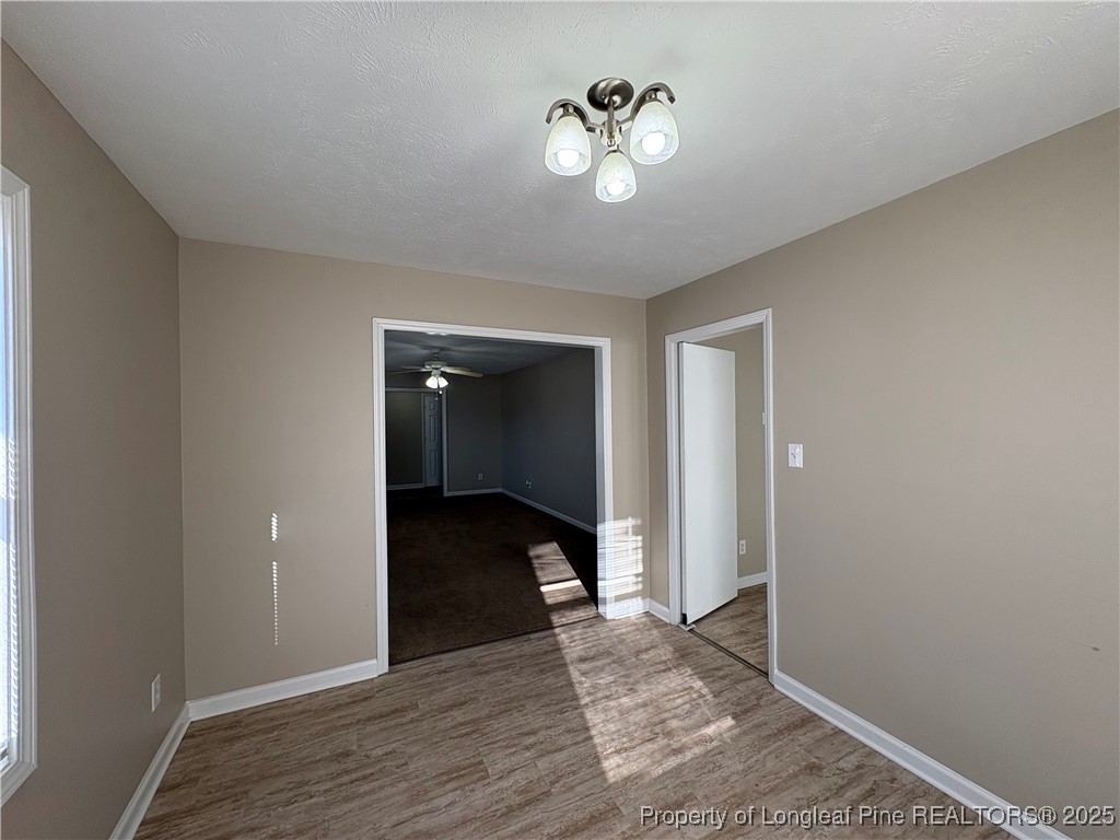 4639 Legion Road Hope Mills, NC 28348 - Photo 7 of 35 a view of an empty room with wooden floor