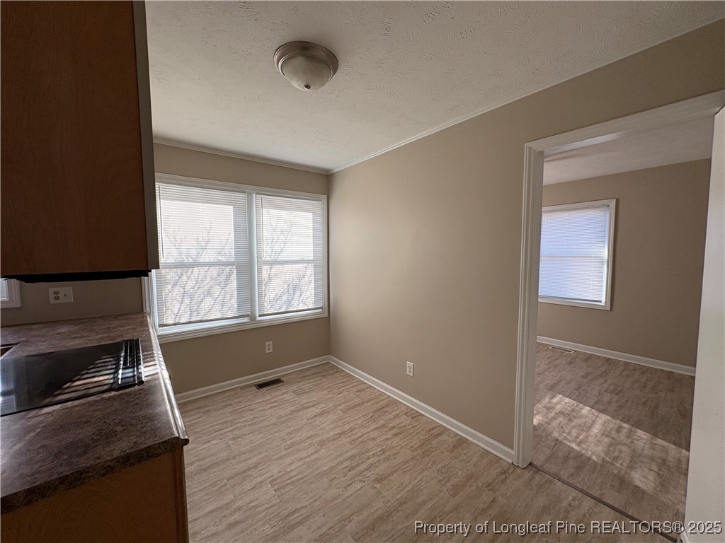 4639 Legion Road Hope Mills, NC 28348 - Photo 8 of 35 a view of empty room with wooden floor and fan