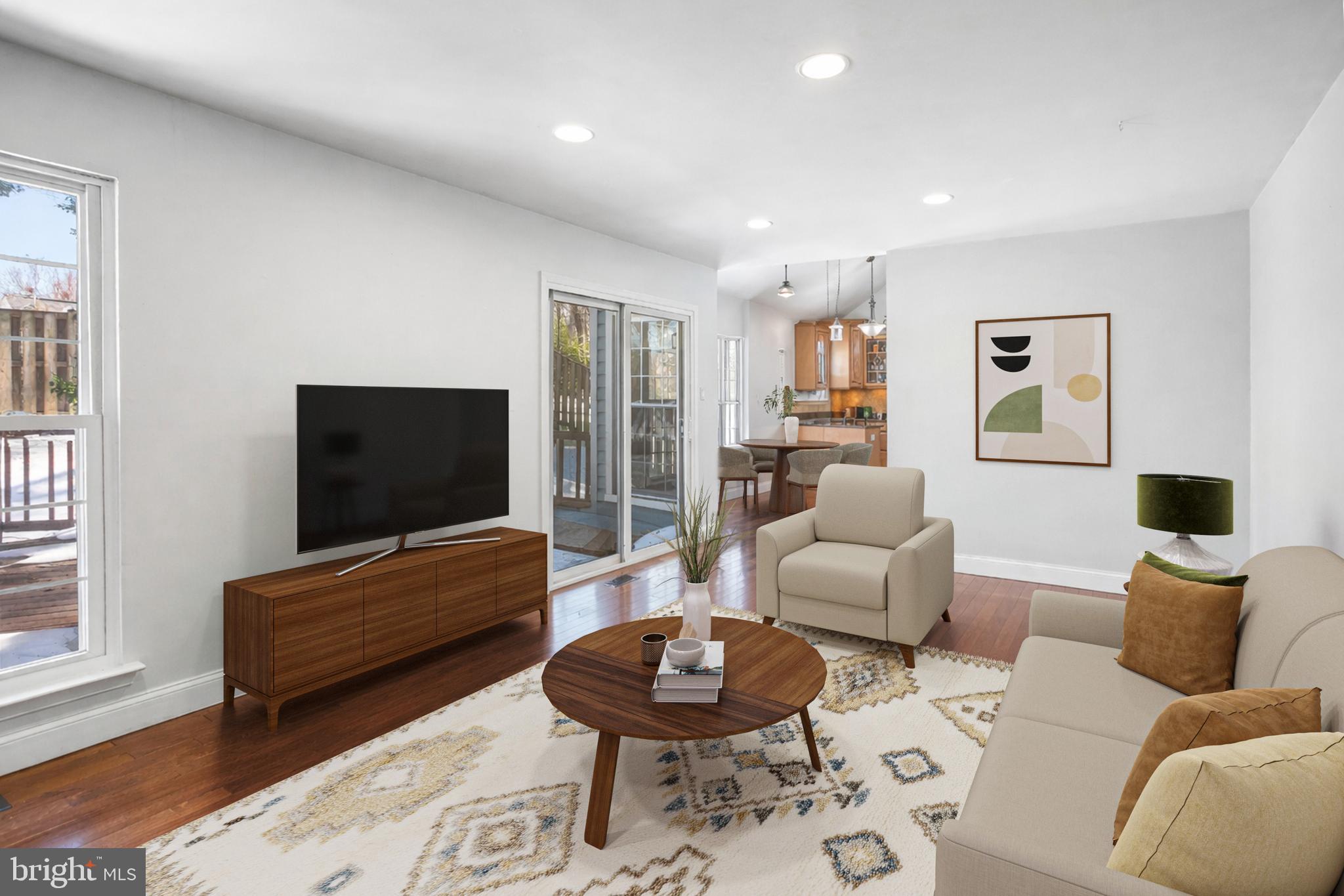 8217 Bayberry Ridge Road Fairfax Station, VA 22039 - Photo 11 of 35 a living room with furniture and a flat screen tv