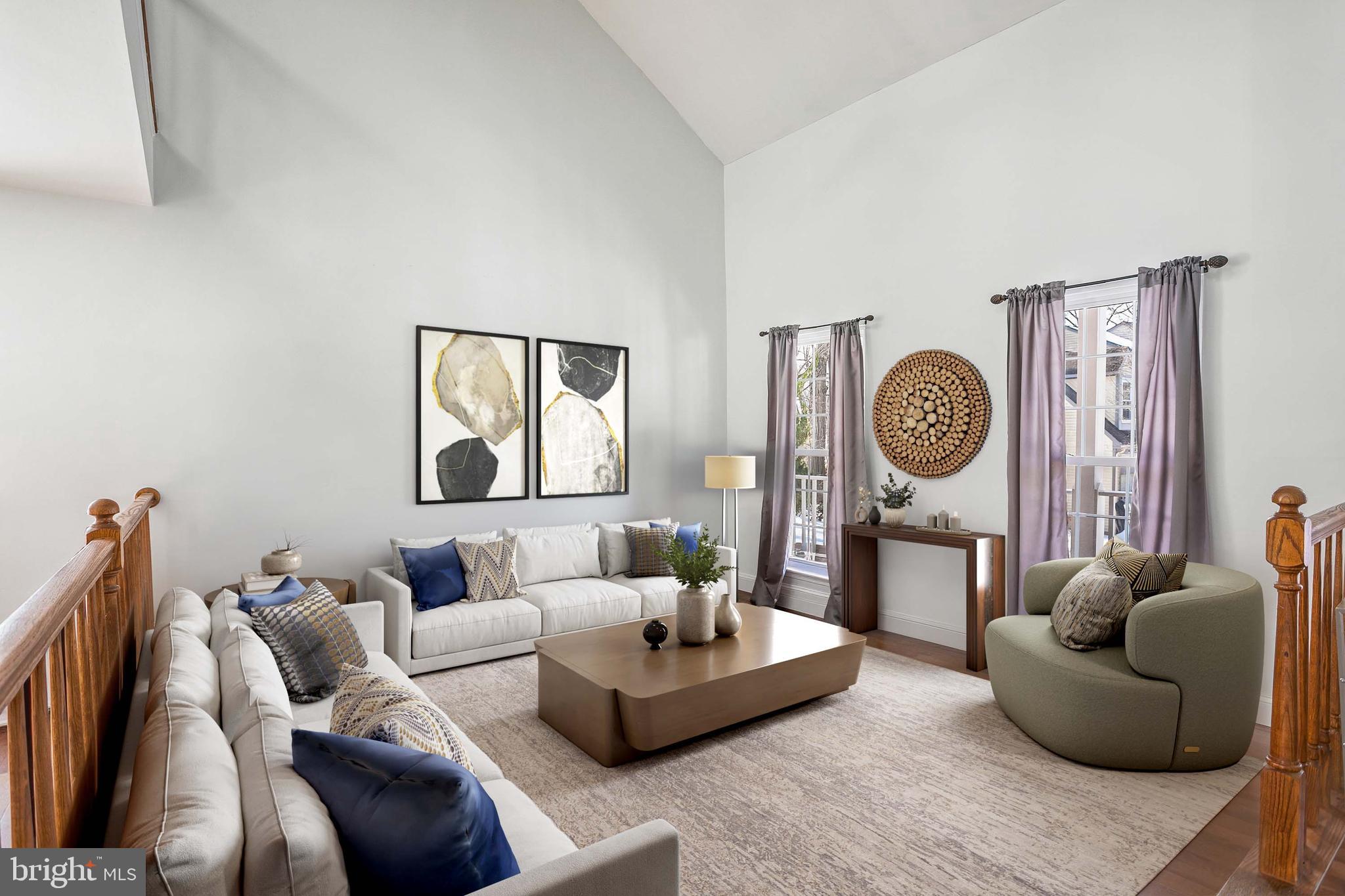 8217 Bayberry Ridge Road Fairfax Station, VA 22039 - Photo 15 of 35 a living room with furniture and a wall painting
