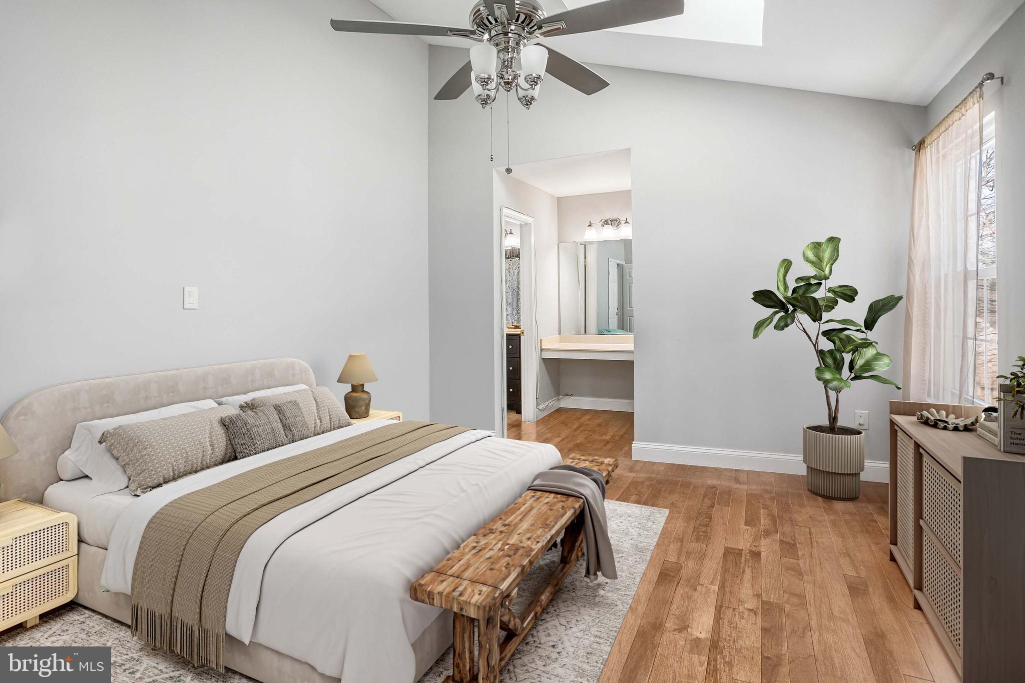 8217 Bayberry Ridge Road Fairfax Station, VA 22039 - Photo 19 of 35 a bedroom with a bed and a potted plant