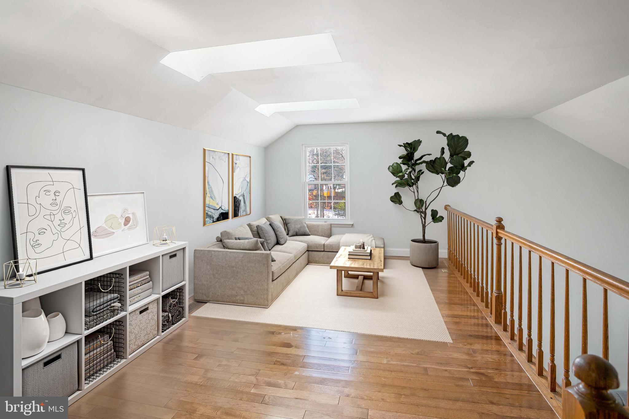 8217 Bayberry Ridge Road Fairfax Station, VA 22039 - Photo 24 of 35 a living room with furniture and a wooden floor