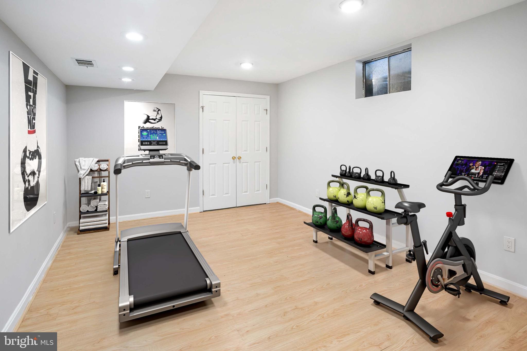 8217 Bayberry Ridge Road Fairfax Station, VA 22039 - Photo 27 of 35 a living room with furniture and a flat screen tv
