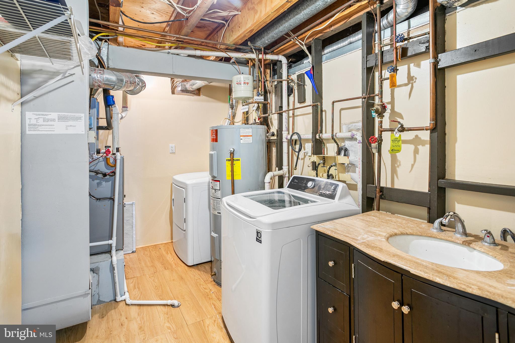 8217 Bayberry Ridge Road Fairfax Station, VA 22039 - Photo 28 of 35 a utility room with dryer and washer