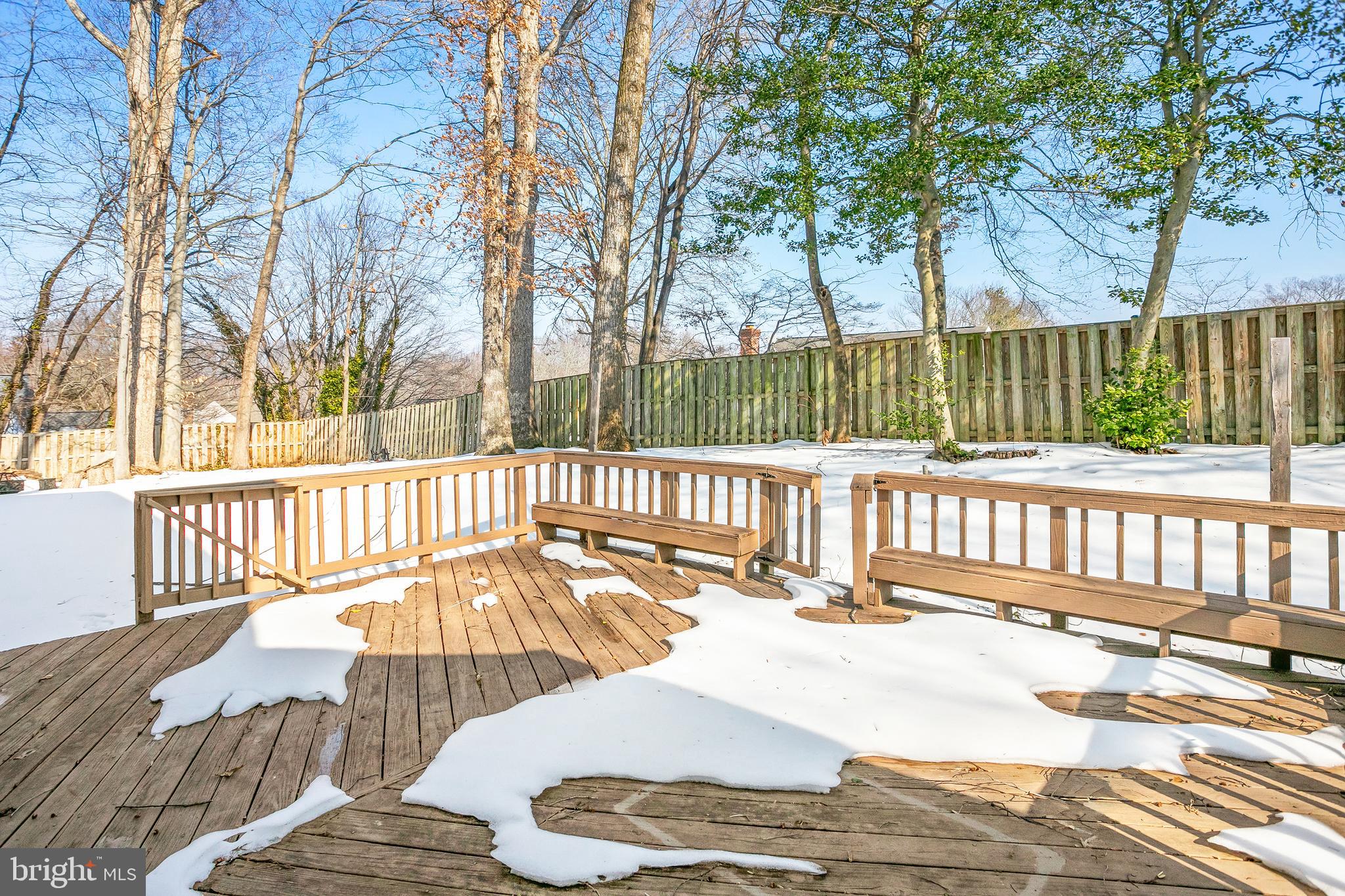 8217 Bayberry Ridge Road Fairfax Station, VA 22039 - Photo 29 of 35 a view of a patio with a table and chairs