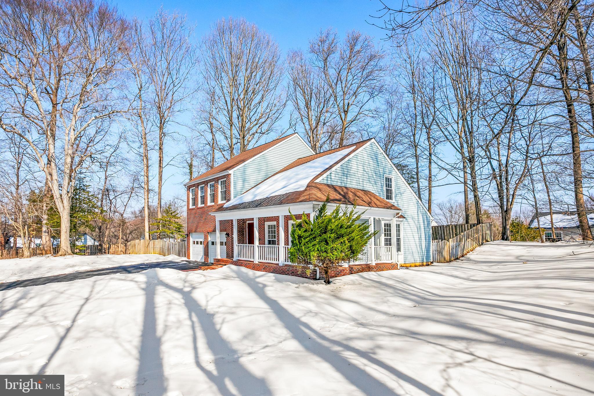 8217 Bayberry Ridge Road Fairfax Station, VA 22039 - Photo 3 of 35 a view of a building with snow on the road