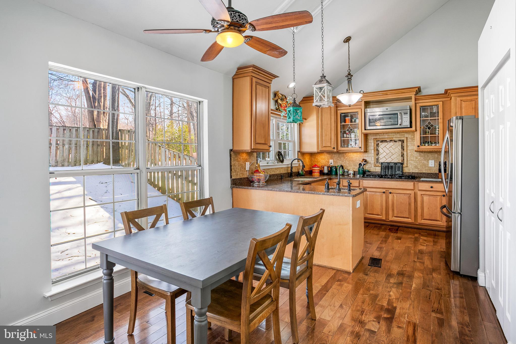 8217 Bayberry Ridge Road Fairfax Station, VA 22039 - Photo 8 of 35 a dining room filled with furniture and window