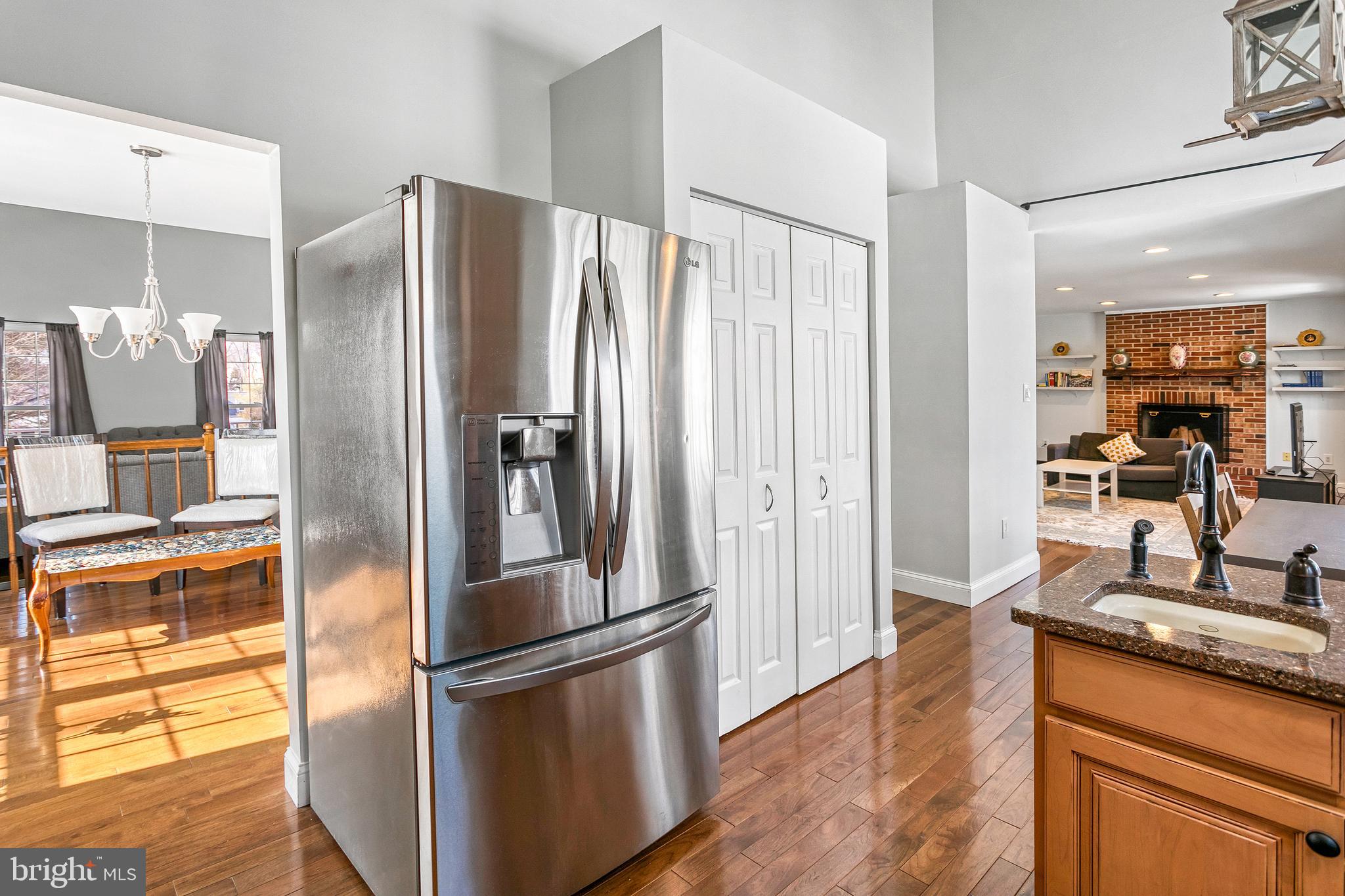 8217 Bayberry Ridge Road Fairfax Station, VA 22039 - Photo 9 of 35 a kitchen with stainless steel appliances granite countertop a refrigerator and a sink