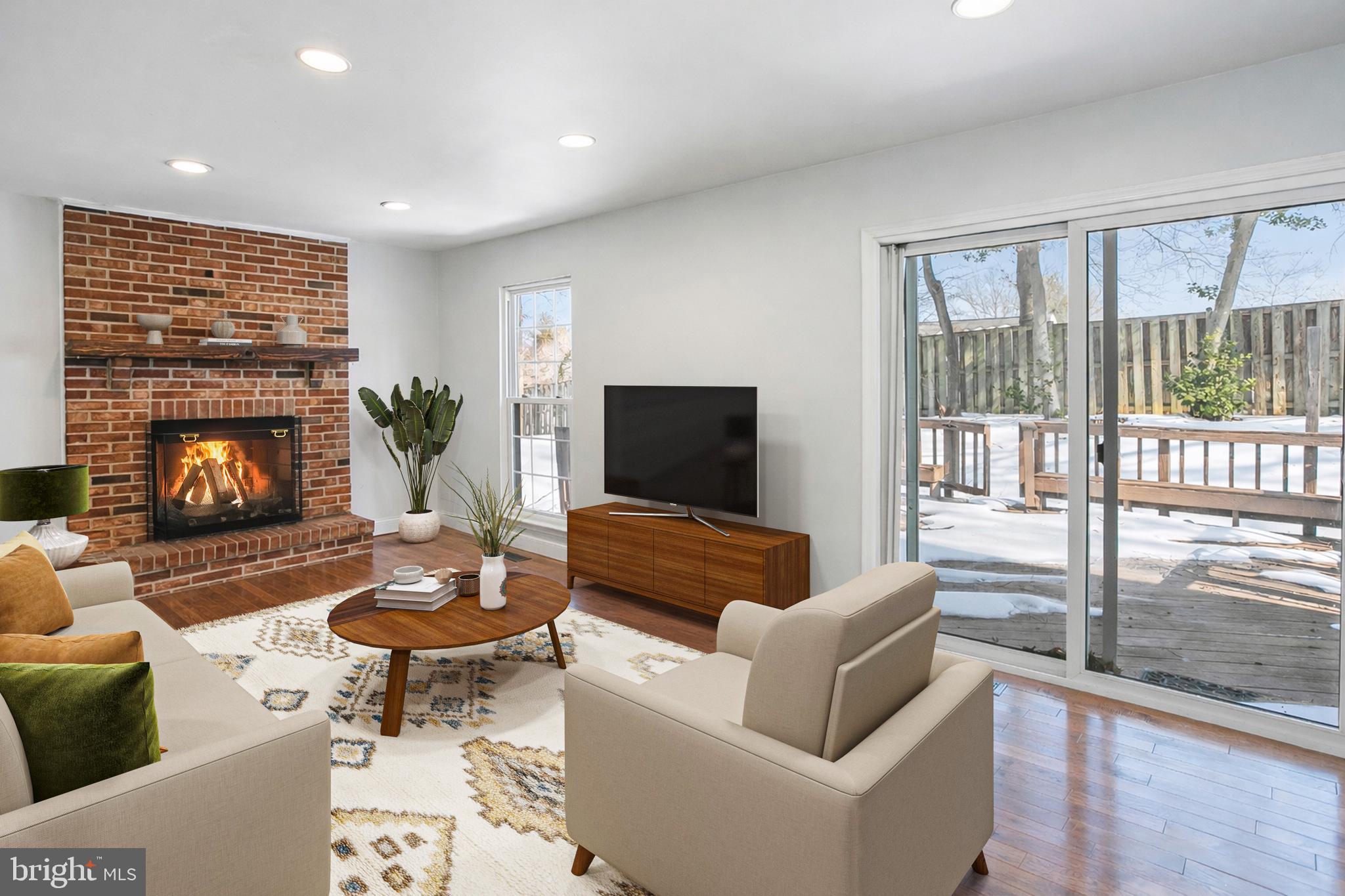 8217 Bayberry Ridge Road Fairfax Station, VA 22039 - Photo 10 of 35 a living room with furniture and a fireplace