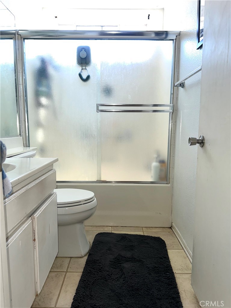 1204 Lilac Ridge Drive Perris, CA 92571 - Photo 12 of 14 a bathroom with a toilet and a shower