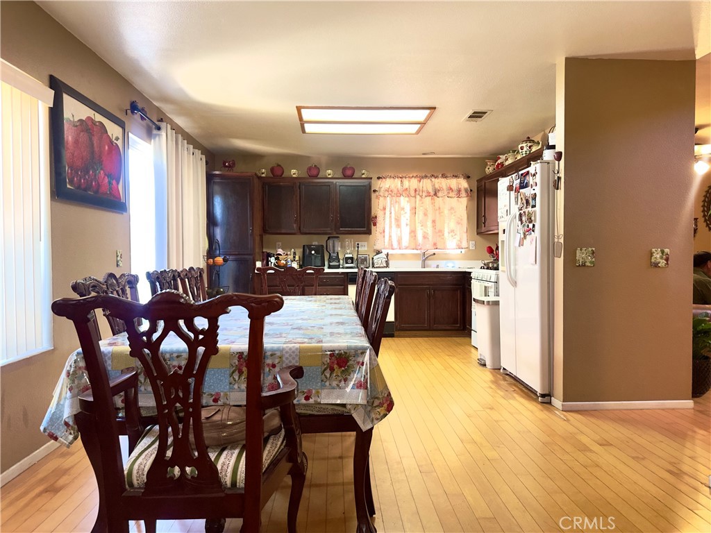 1204 Lilac Ridge Drive Perris, CA 92571 - Photo 4 of 14 a view of a dining room with furniture and window