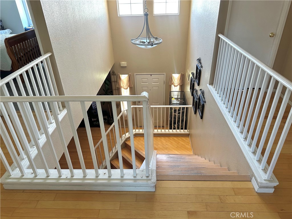 1204 Lilac Ridge Drive Perris, CA 92571 - Photo 7 of 14 a view of entryway and hall with wooden floor