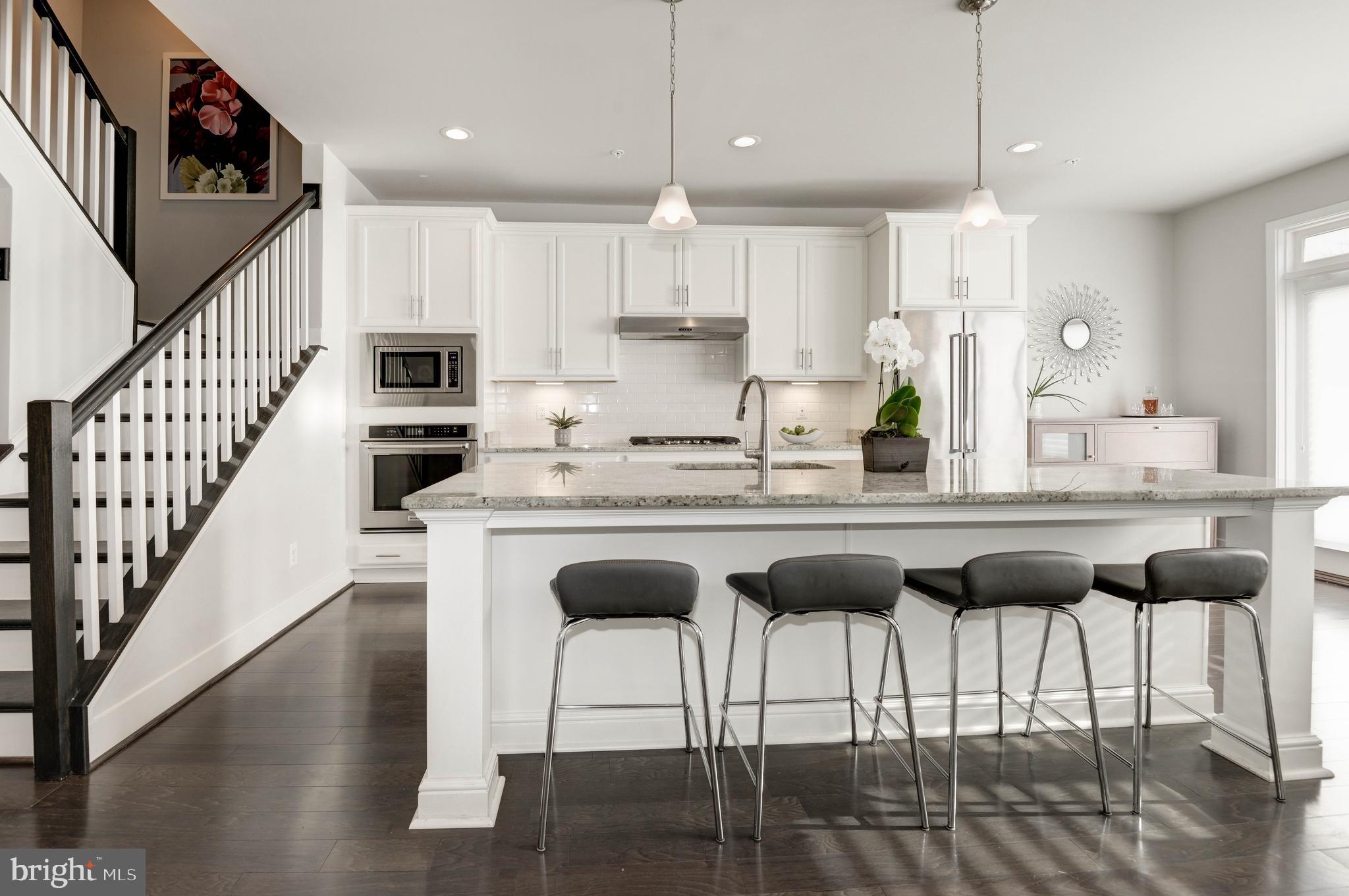 11689 Sunrise Square Place Reston, VA 20191 - Photo 4 of 46 STUNNING WHITE CABINETS W/HUGE ISLAND
