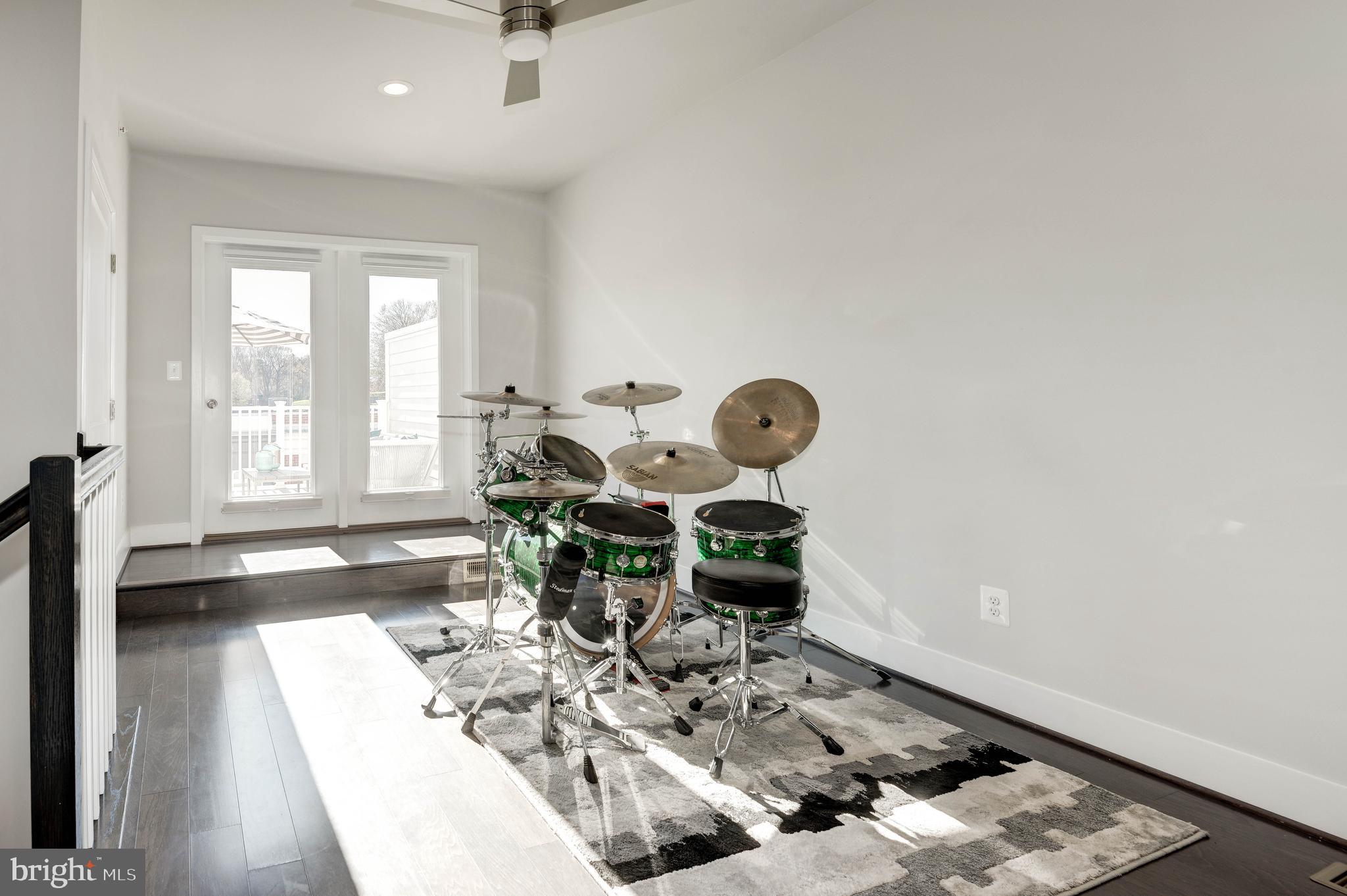 11689 Sunrise Square Place Reston, VA 20191 - Photo 33 of 46 UPPER FAMILY ROOM LEADS TO ROOFTOP TERRACE