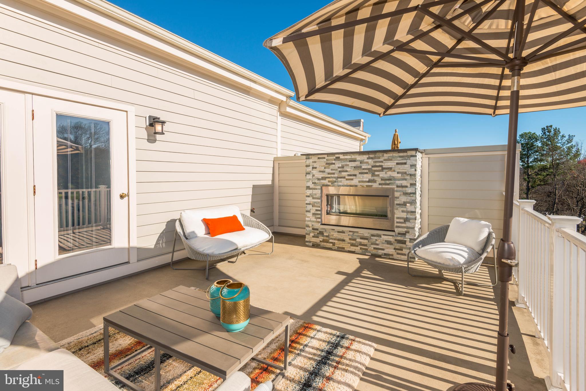 11689 Sunrise Square Place Reston, VA 20191 - Photo 40 of 46 COZY FIREPLACE COMPLETES THIS UPPER TERRACE