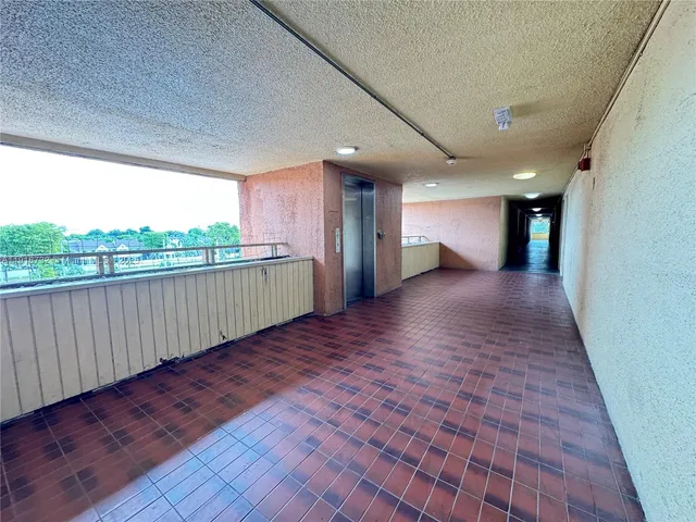 a kitchen with a stove a sink and a refrigerator