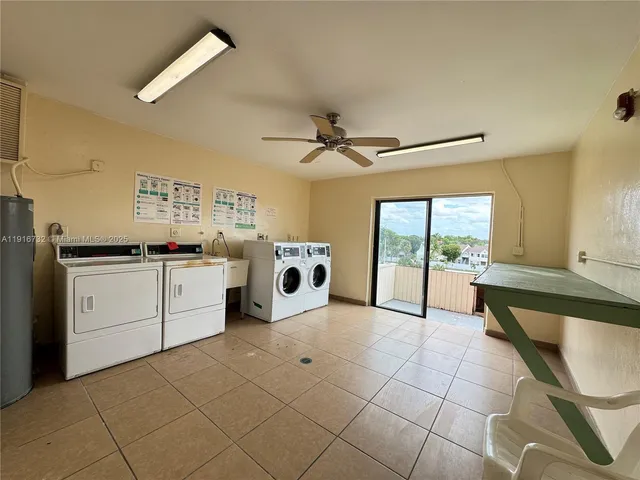 a view of a storage & utility room with washer and dryer